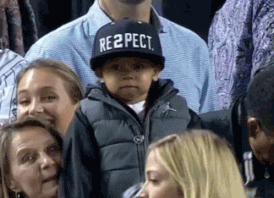 Young boy with black re2pect hat GIF
