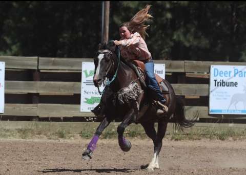 Teen girl riding a horse